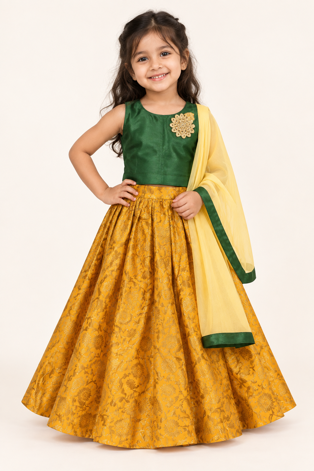 Girl wearing dark green taffeta silk choli, yellow Banarasi brocade lehenga and yellow dupatta, front view
