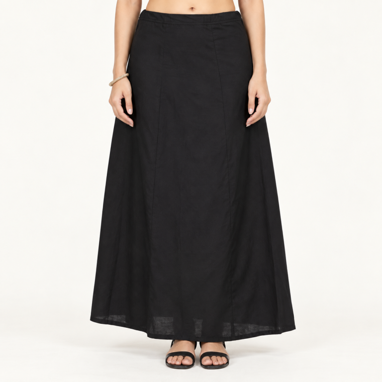 Model wearing a black cotton saree petticoat, complete view from waist to heels